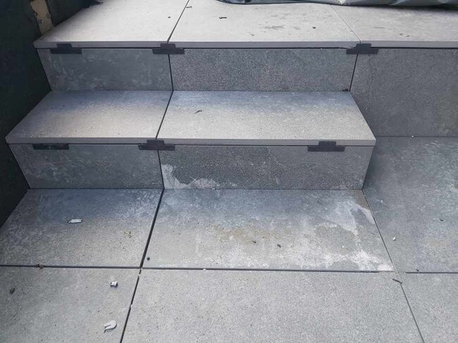 Stairs made of terrace pavers on finishing clips.