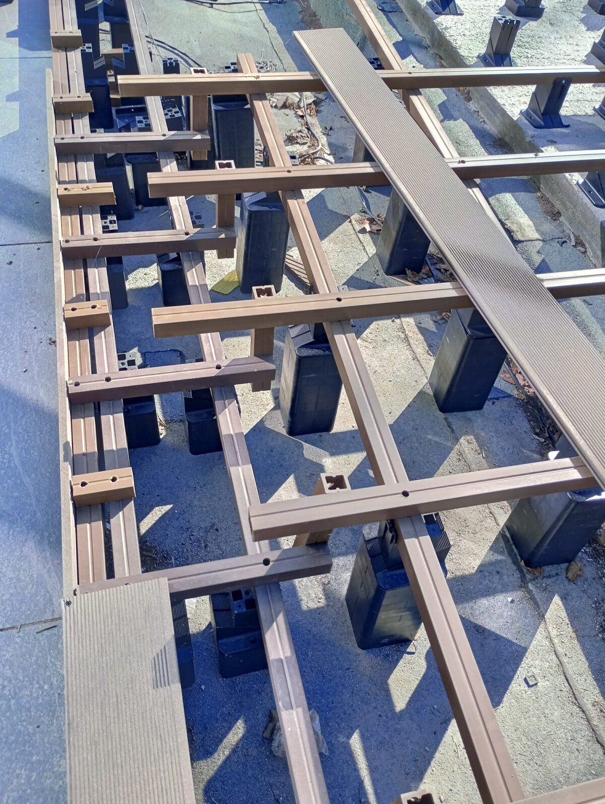 Composite joists laid on terrace pedestals.