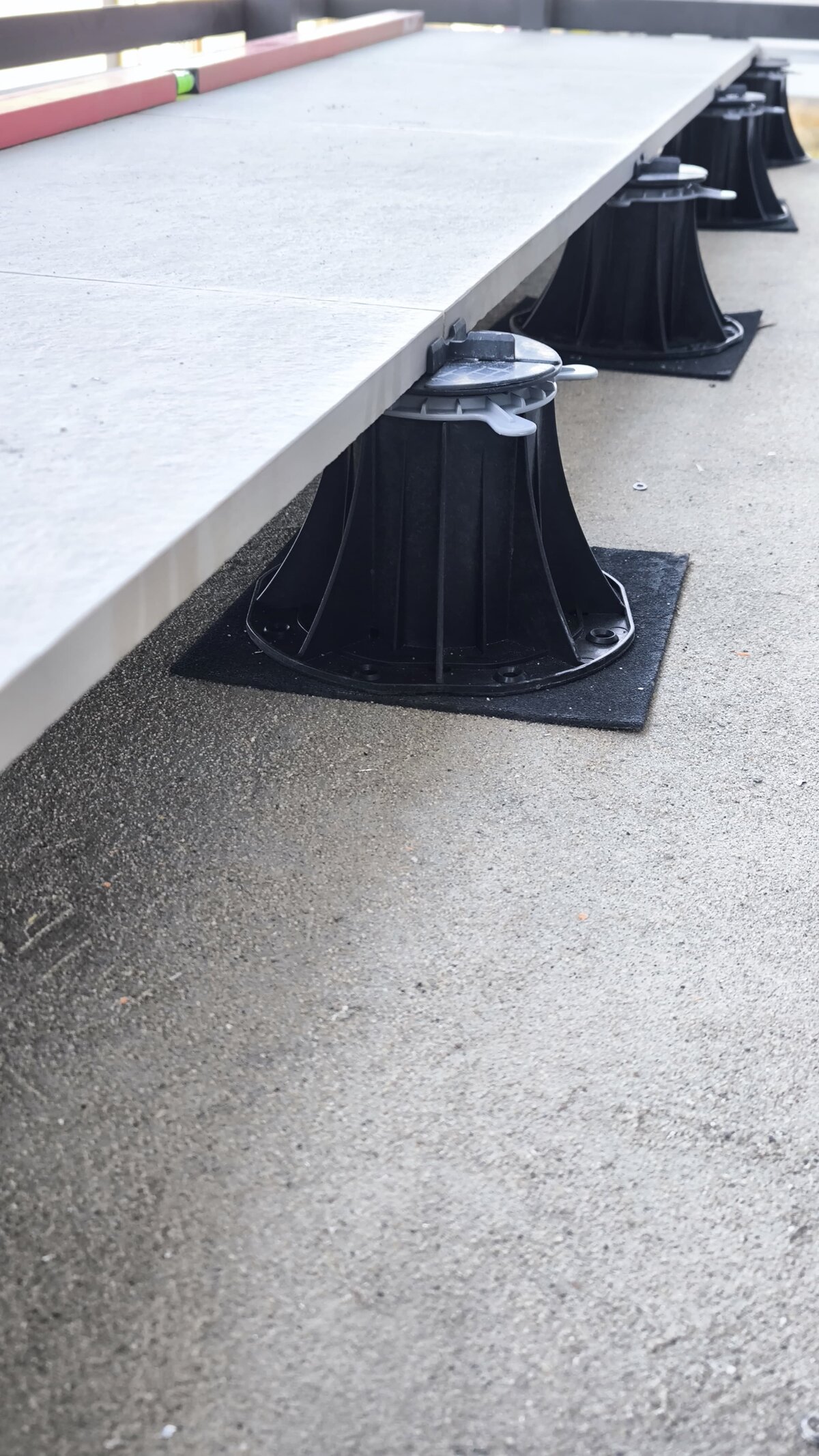 Terrace pavers mounted on adjustable terrace pedestals.