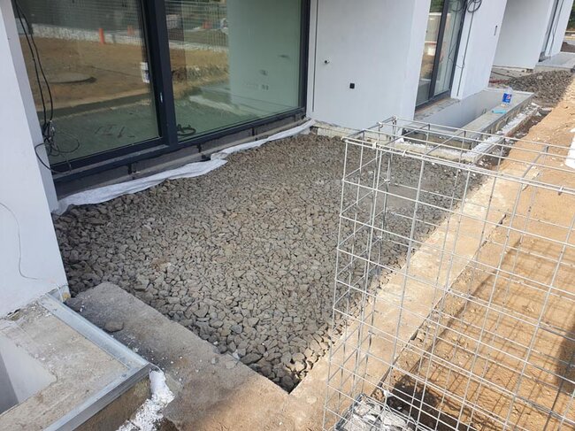 Stone aggregate base for a home terrace.