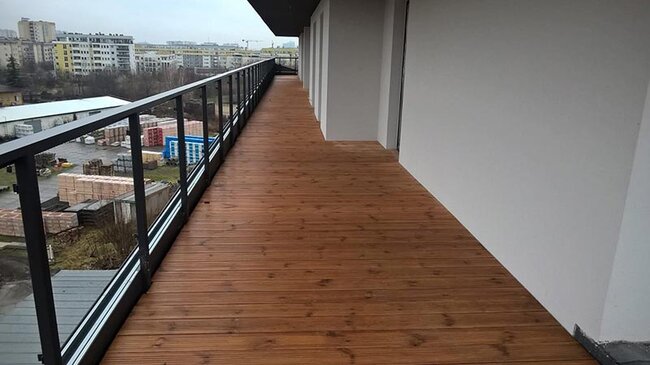 Large rooftop terrace finished with exotic wood decking boards.