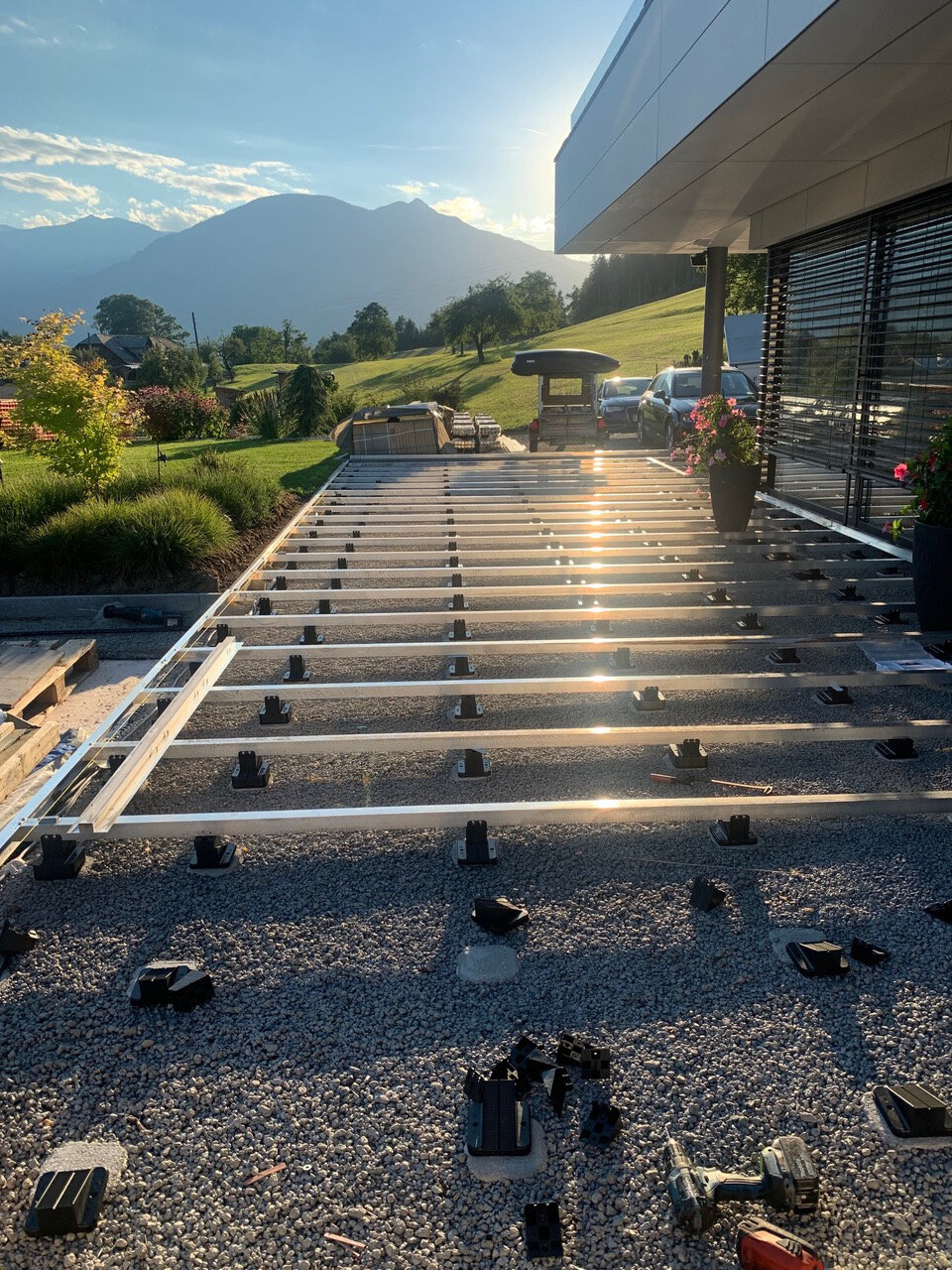 Installation of aluminum joists on adjustable terrace pedestals.