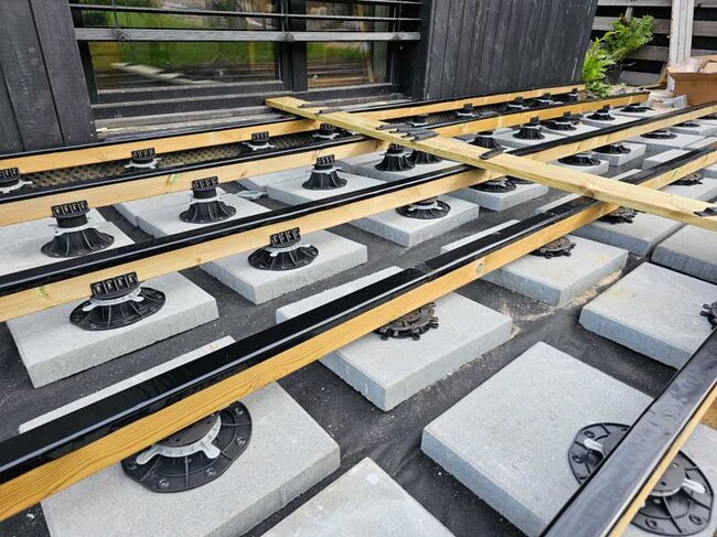 Terrace joists on adjustable pedestals
