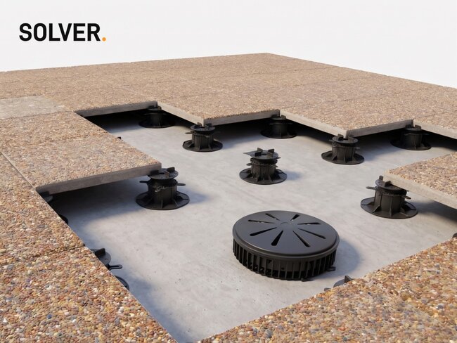 Roof drain and drainage system under terrace pavers on adjustable pedestals.