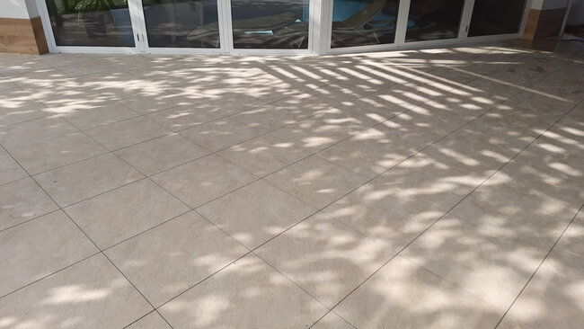 Modern terrace pavers in a light color with visible joints