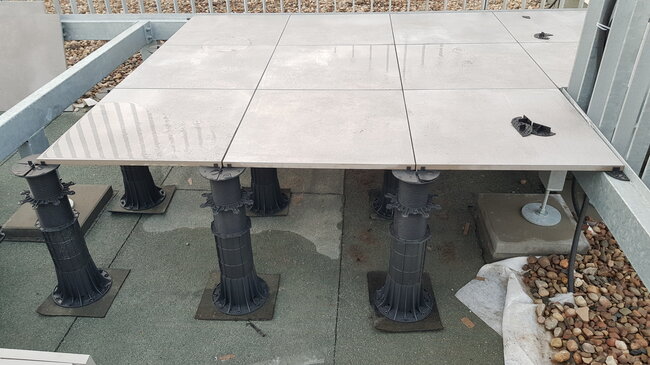 Installation of Max SH SBR terrace pavers on adjustable terrace pedestals