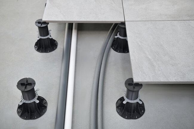 Water or electrical installation routed under the raised deck terrace