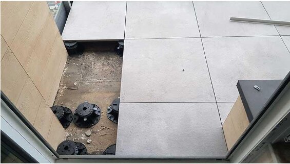 Step by step installation of terrace pavers on support pads 7