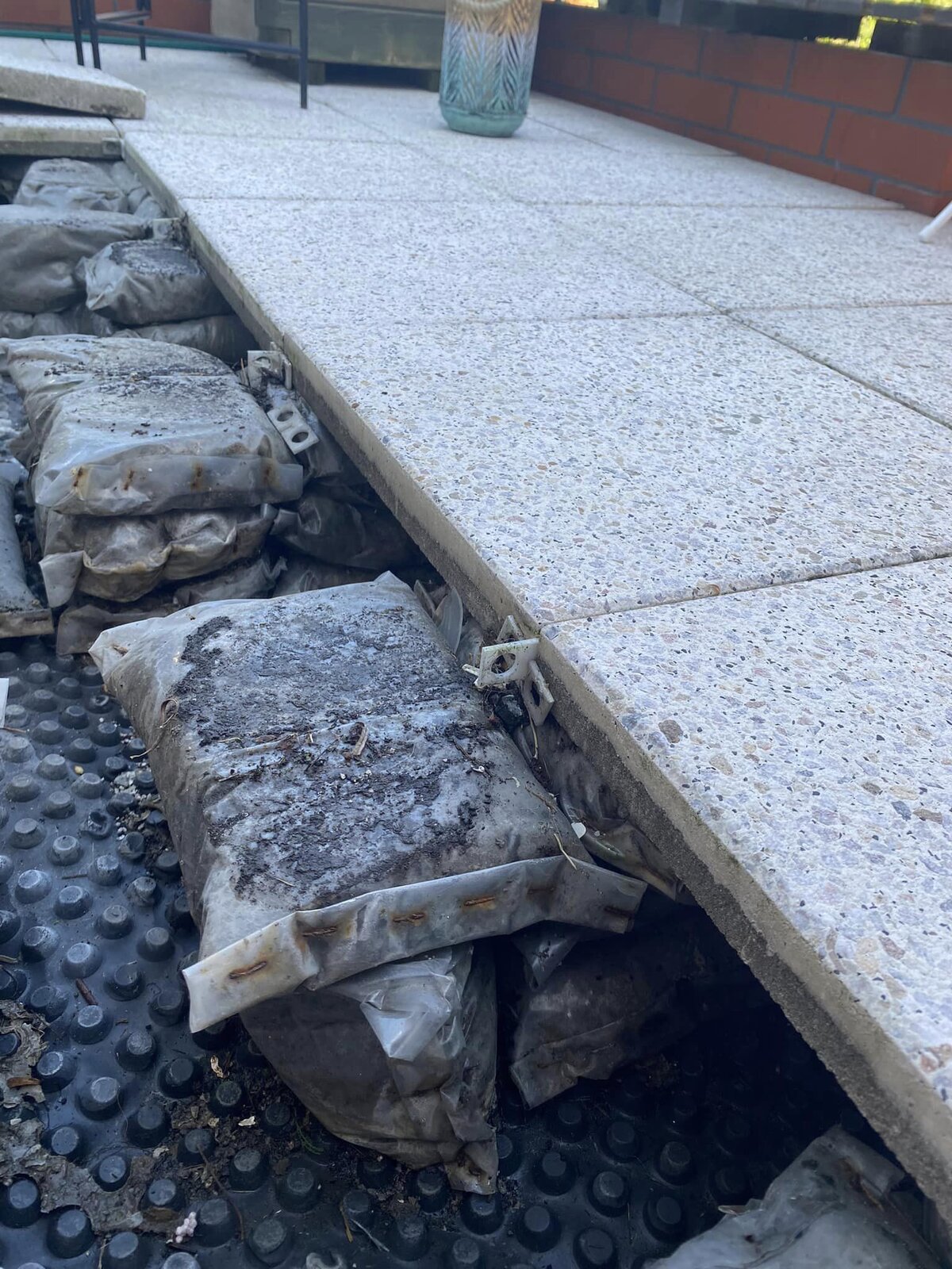`Terrace pavers laid on mortar bags terrace substrate`