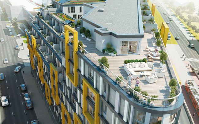 Modern commercial residential building design showcasing a large rooftop terrace and paver deck.