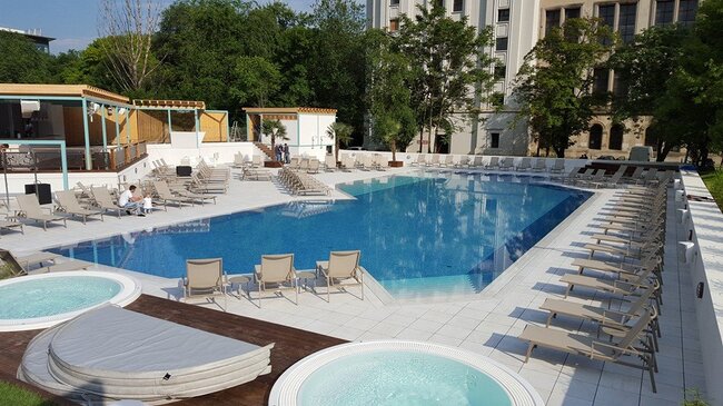 Raised pavers pool deck built with adjustable pedestal system.
