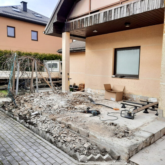 Terrace ground preparation and demolition before installing composite decking on adjustable pedestals.